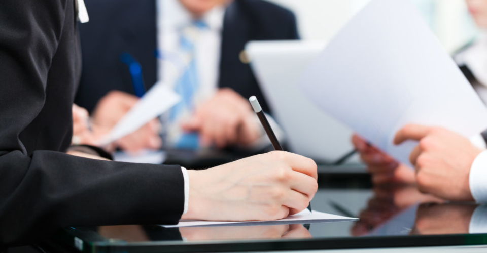 Business meeting with work on contract
